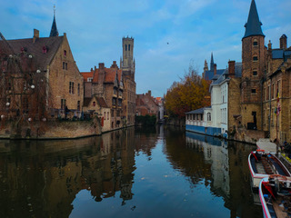 Bruges, Belgium — Medieval architecture reflected along a canal
