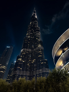 Dubai, UAE — Burj Khalifa above the Dubai skyline at night